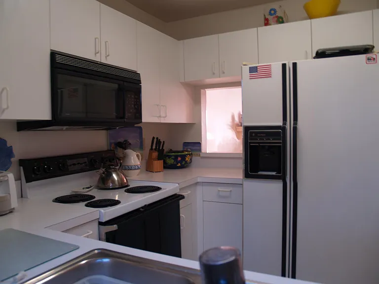 Second of two kitchen pictures, this one shows the pass through to the dining room.