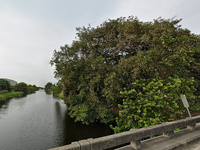 The townhouse at 3609 Townhouse Ct, West Palm Beach, FL 33407, offers a serene lakefront setting. The property features a charming lake, providing residents with a tranquil and picturesque environment.