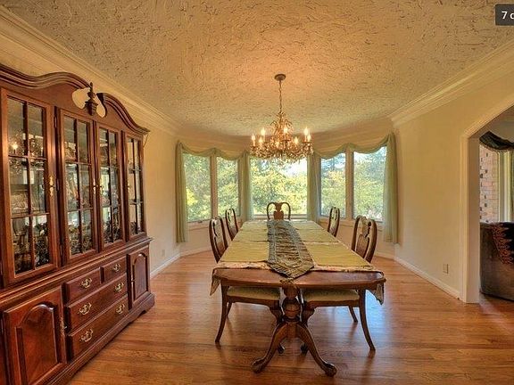 Gorgeous formal dining overlooking the landscaped front yard