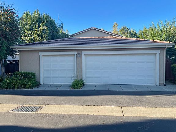 Three car garage with storage cabinets. This sized garage is a rare find for homes being currently rented.