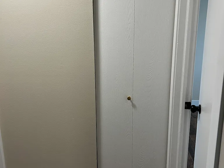 Hall closet between bedrooms