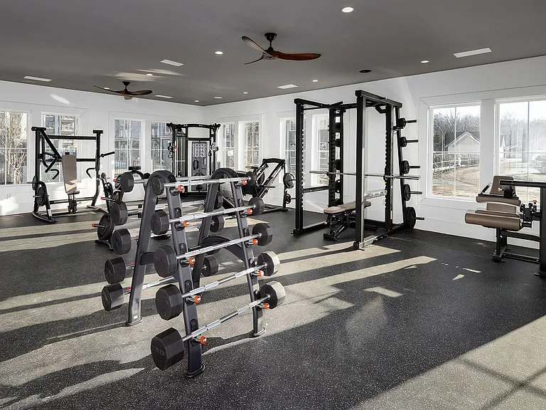 Spacious Fitness Center with Weight Equipment and Natural Light