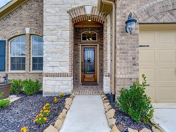 Upgraded door with Texas Star. Stone and brick elevation.