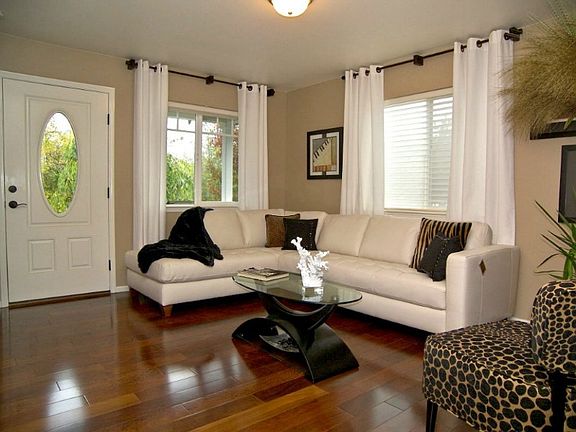 Upon entering the front door you are welcomed into a formal living area with lots of light. Neutral colors balance out the warm Brazilian hardwood floors. It's both welcoming and impressive.