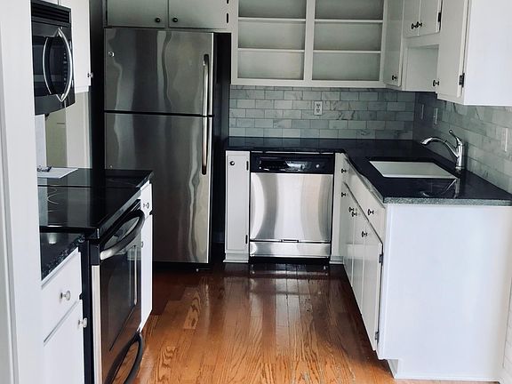 Hardwood floor kitchen and hall.