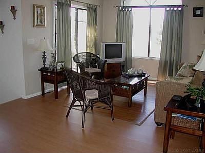 Great room with patio door to balcony. Very bright!!! Two-tone neutral paint.