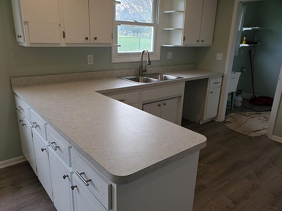 Notice Laundry off of kitchen!