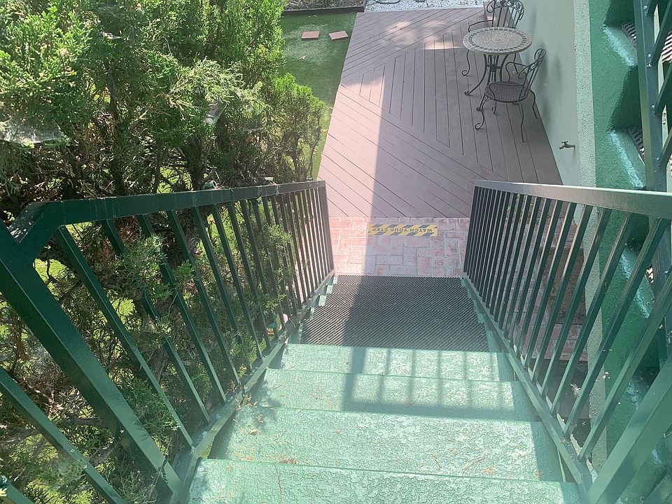 From your downstairs patio and yard, this is one set of stairs going up to your studio.