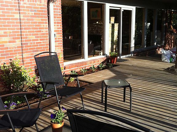 Sliding glass onto deck overlooking wooded lot
