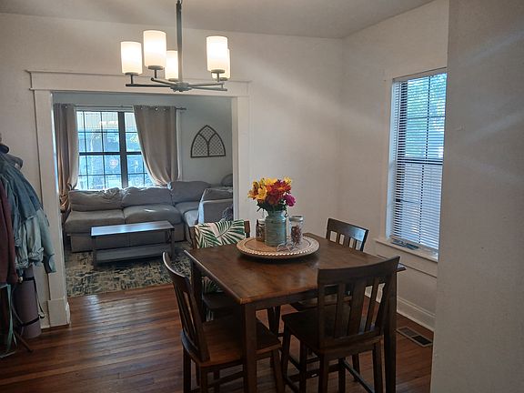 View from kitchen towards nook area and living room at front of home.