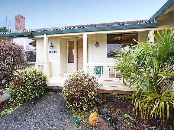 The roomy covered porch and entry offer room for bench seating & protection against the elements.