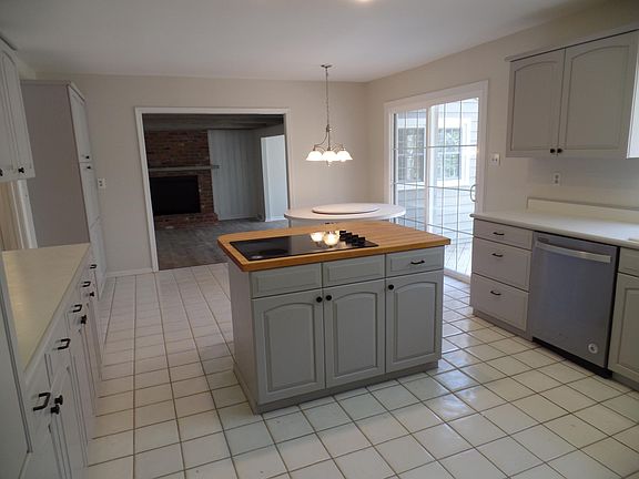 Tile kitchen floor looking into den area