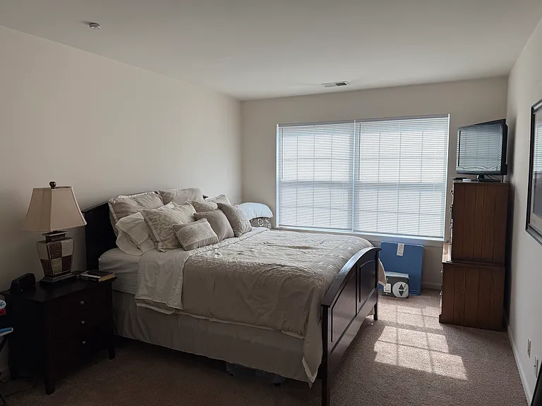 Bright and airy third bedroom offering a versatile floor plan and excellent closet storage close to the second full bath.