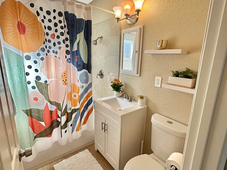 Private bathroom with shower and tub