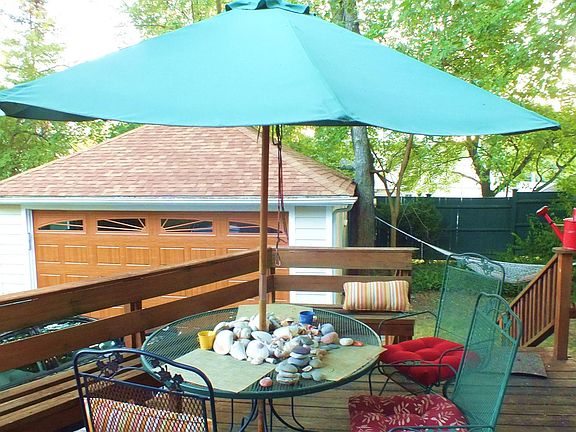Large rear deck for entertaining with built in seating and 2 car garage (available if finished)