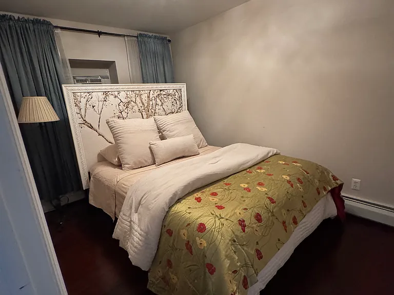 Bedroom with closet and a/c.
