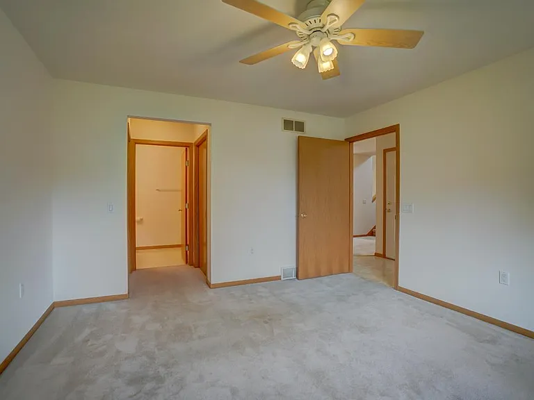 Primary bedroom on main level with private full bath and 2 closets