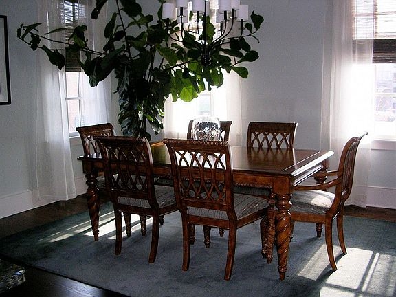Dining room is open to kitchen, has custom lighting and gets great natural light.
