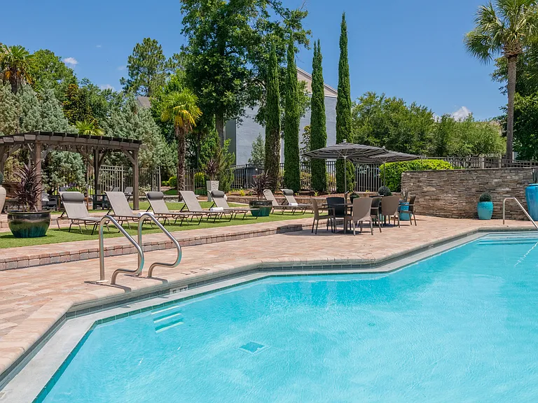 Our radiant poolside oasis invites relaxation under the Florida sun.