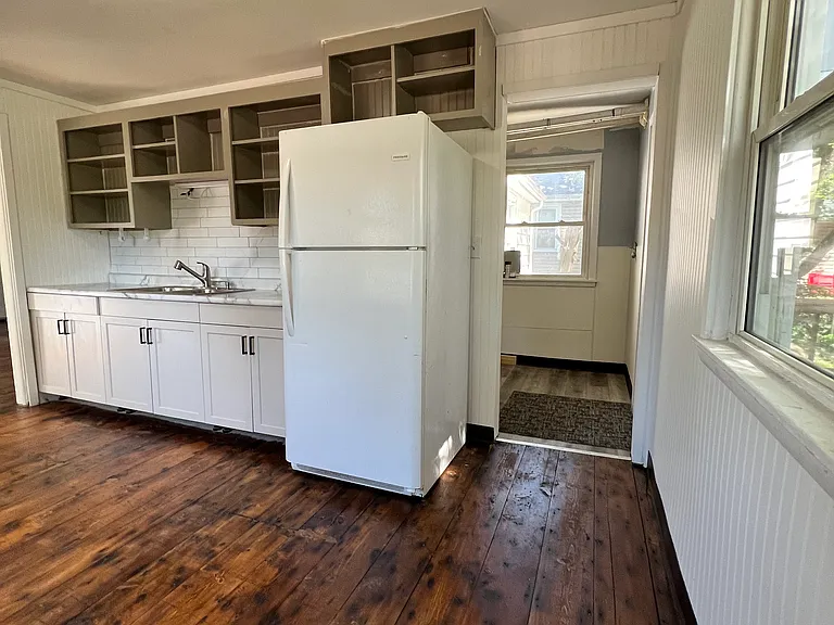 Kitchen with door into laundry/utility room