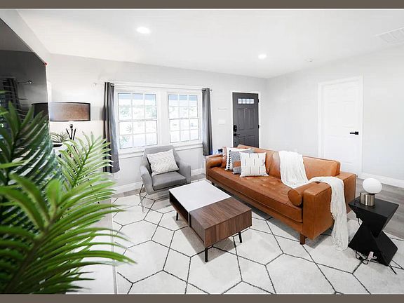 A clean, modern interior design transforms the living room.
