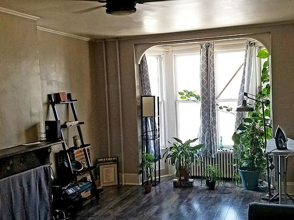 Huge living room with tons of natural light with bay window