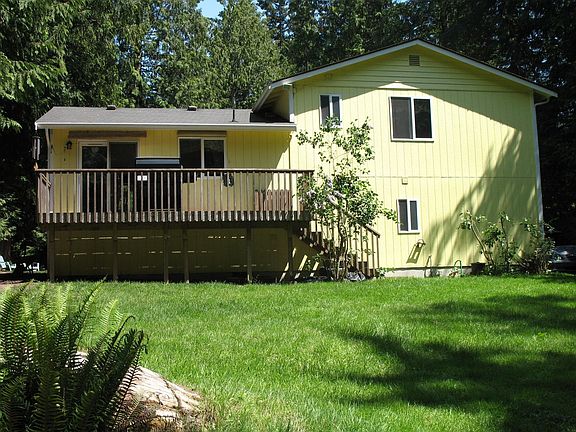 Lush, open backyard, natural boarders, even huckleberries!