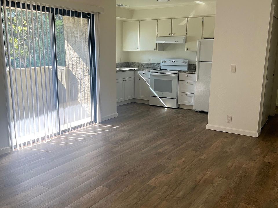 from front door entry; kitchen living and balcony slider