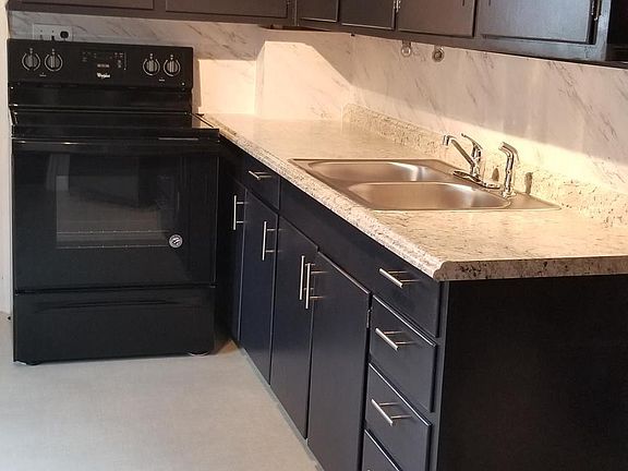 update kitchen .. new countertop, electric range, sink, cabi