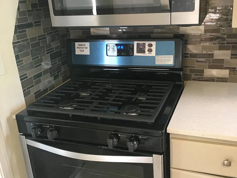 Stainless steel gas range and microwave