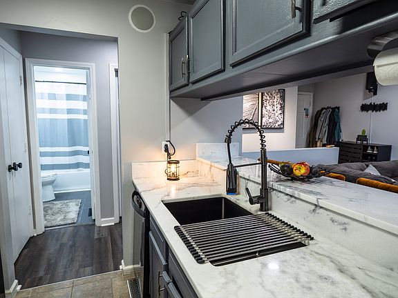 Open kitchen with bar and new appliances