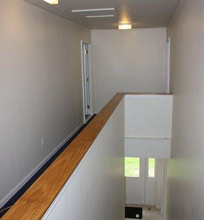 View of secure and locked outer hallway from second floor.