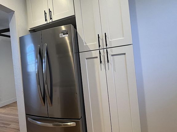 Kitchen also included floor to ceiling panty.