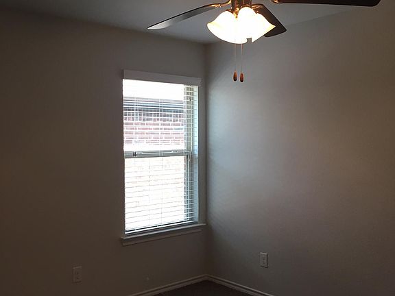 Second bedroom, also with ceiling fan.