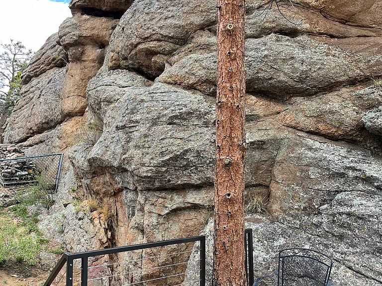 Bolts and Anchors are installed along the property's rock feature for technical rock climbing (at your own risk). Longs, Twin Sisters and Mt. Meeker views are outstanding from the top.