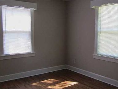 Master bedroom with hardwood floor and cedar lined closet