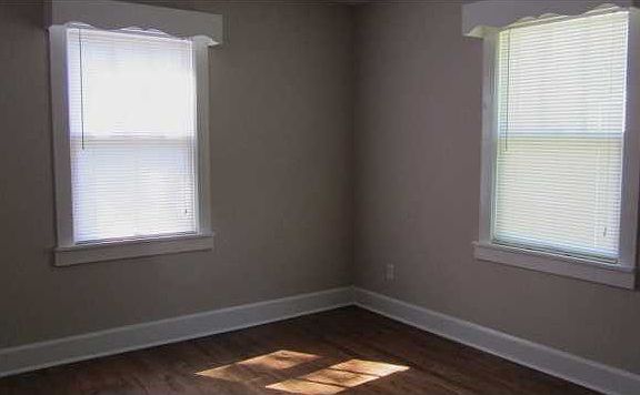 Master bedroom with hardwood floor and cedar lined closet