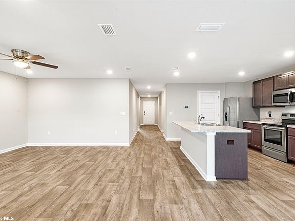Vinly Floors and Ceiling Fan in living area