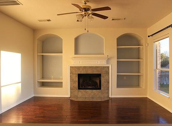 Living Room. Built in Book case and fireplace