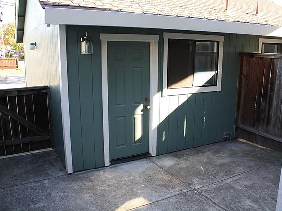 Detached garage entrance inside gated portico