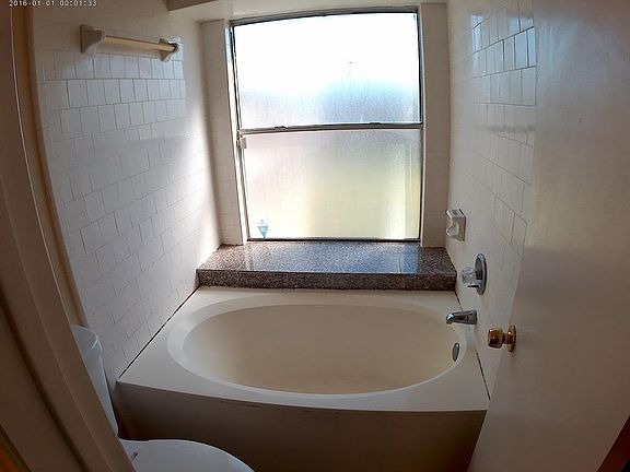 Garden tub that has a full window for lots of natural light.