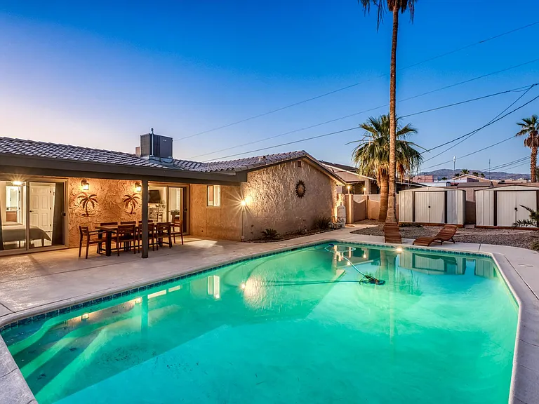 Covered patio overlooking pool _ ideal indoor/outdoor living.