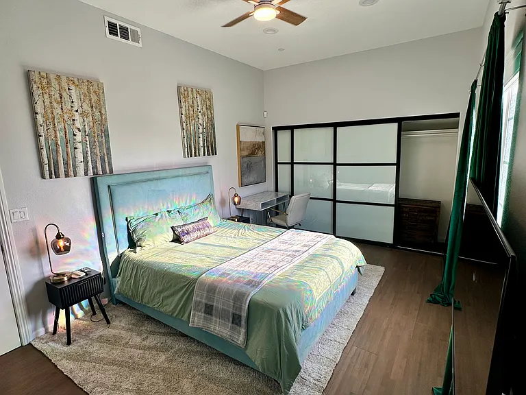 Downstairs bedroom 3 with queen bed, 36in TV and desk