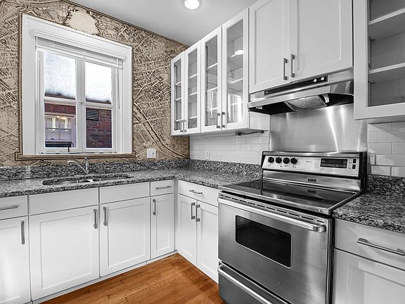 Kitchen - granite countertops, stainless steel appliance package, salvaged hardwood floors