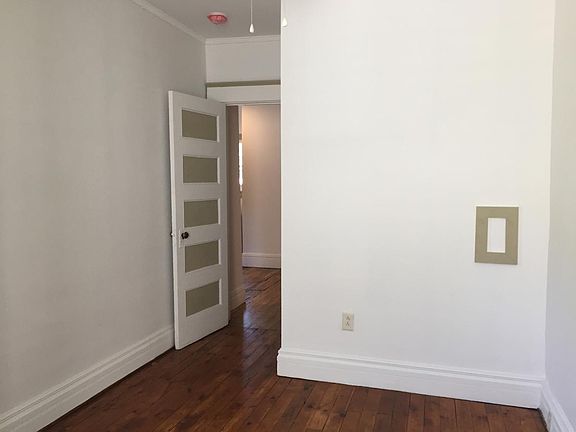 Bedrooms are bright and clean with warm wood floors