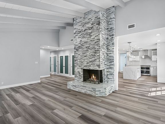 Living Room with Vaulted Ceilings and fireplace