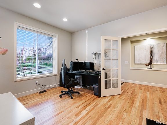 Glass pane French doors open to your home office work space or make it a guest suite! There's a 3/4 bath with shower on the main level too!