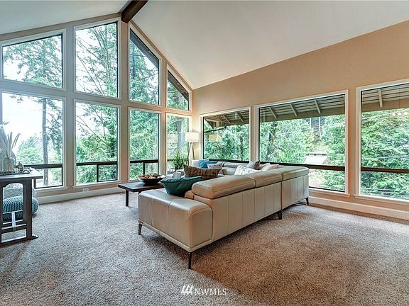 Beautiful vaulted ceilings in the main floor living space with a great view overlooking the   mountains and sound