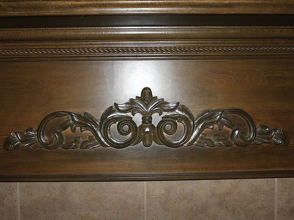 wood detail above fire place