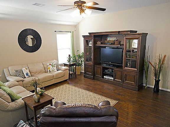 Spacious Den with Laminate wood flooring